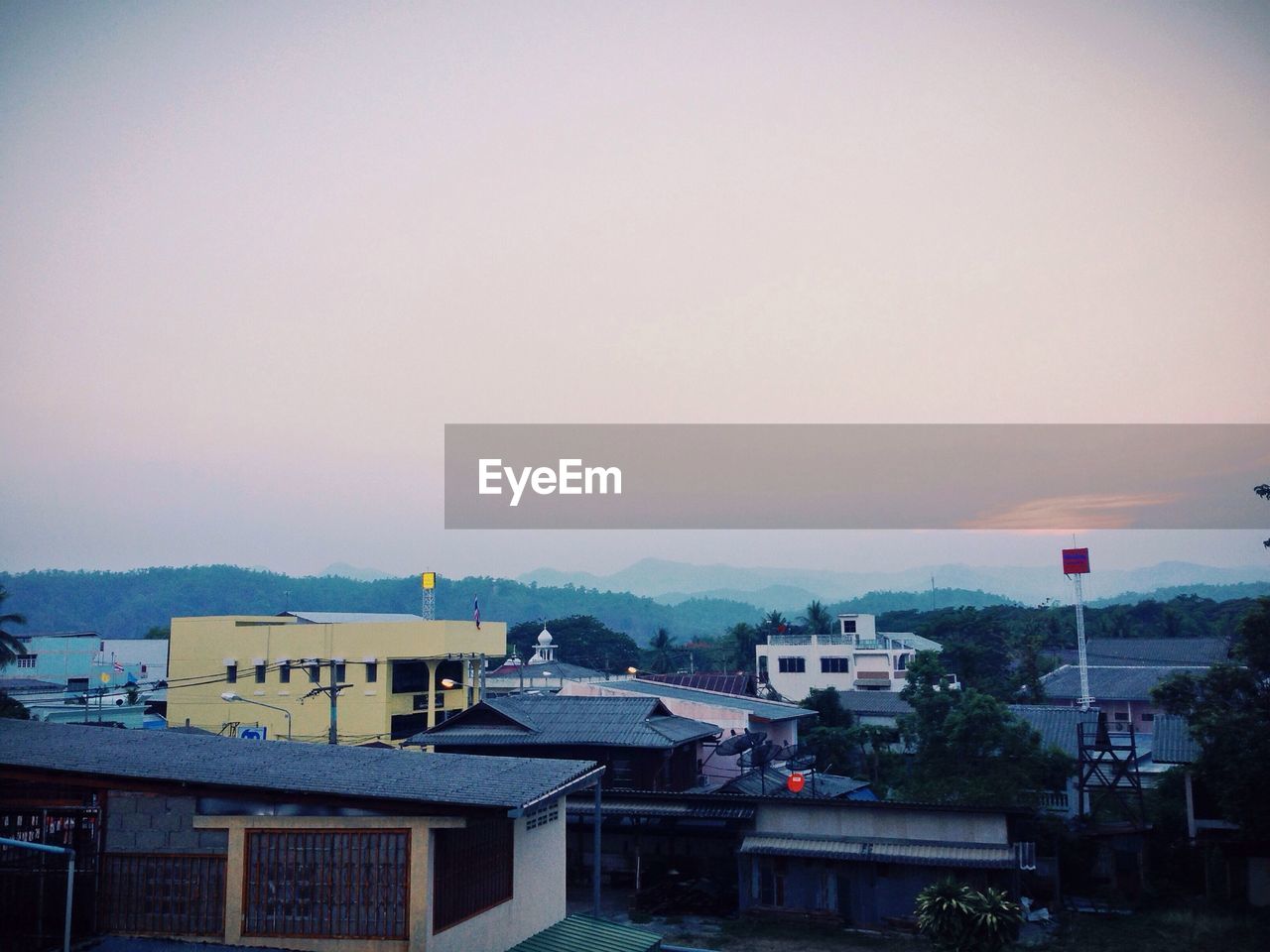 Exterior of houses against sky at dusk