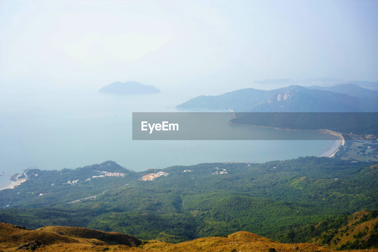 SCENIC VIEW OF SEA AND MOUNTAIN AGAINST SKY