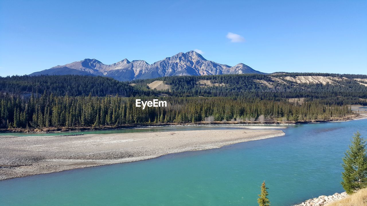 Scenic view of athabasca river against sky