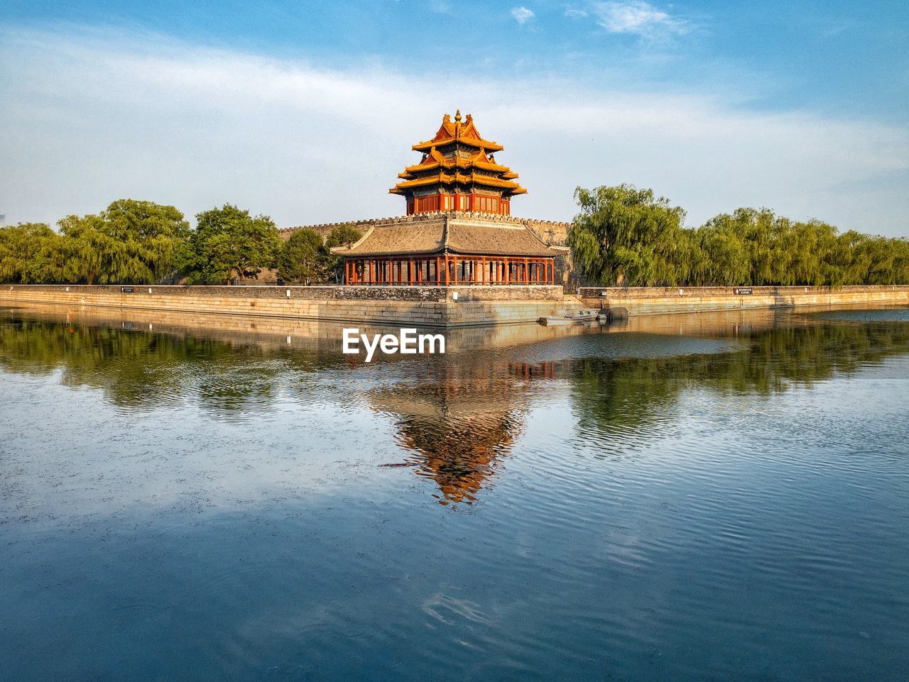 REFLECTION OF BUILDING ON LAKE