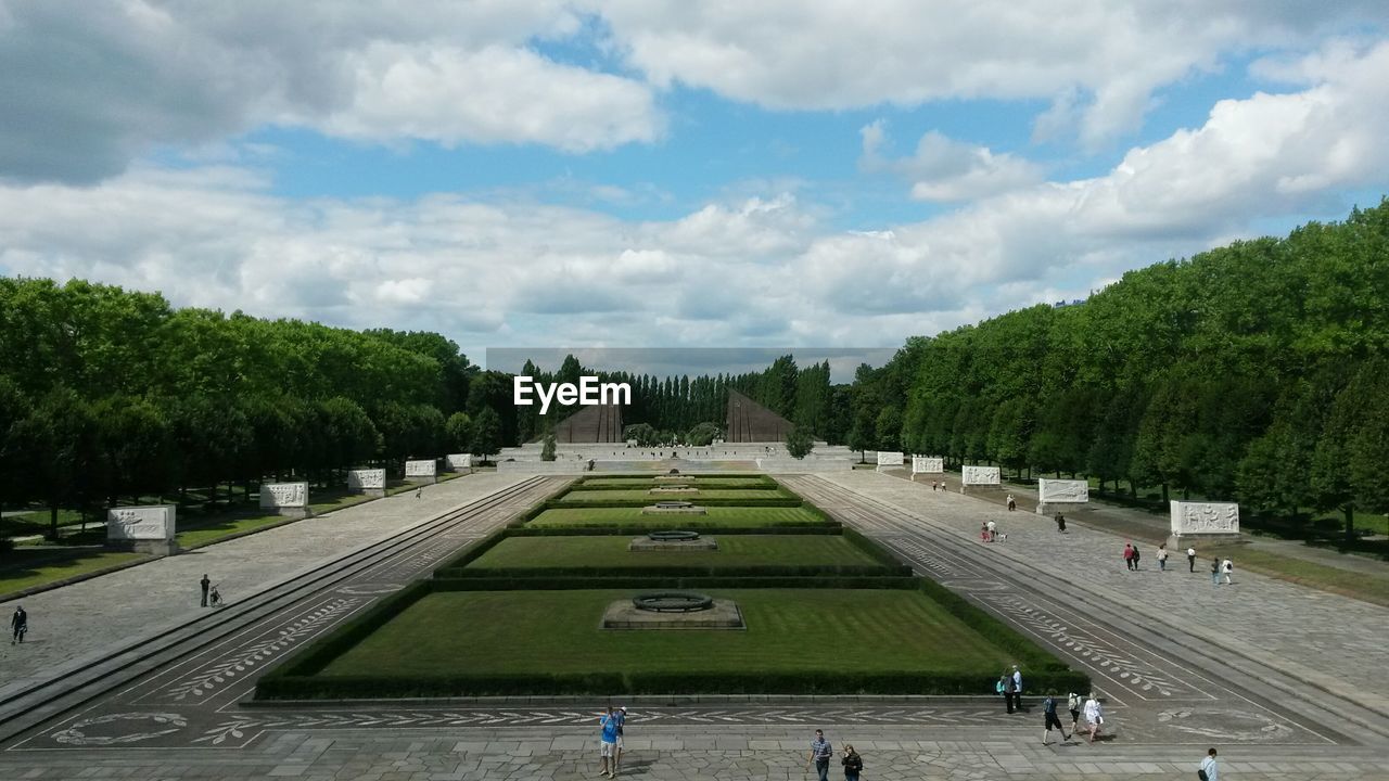 VIEW OF TREES AGAINST CLOUDY SKY