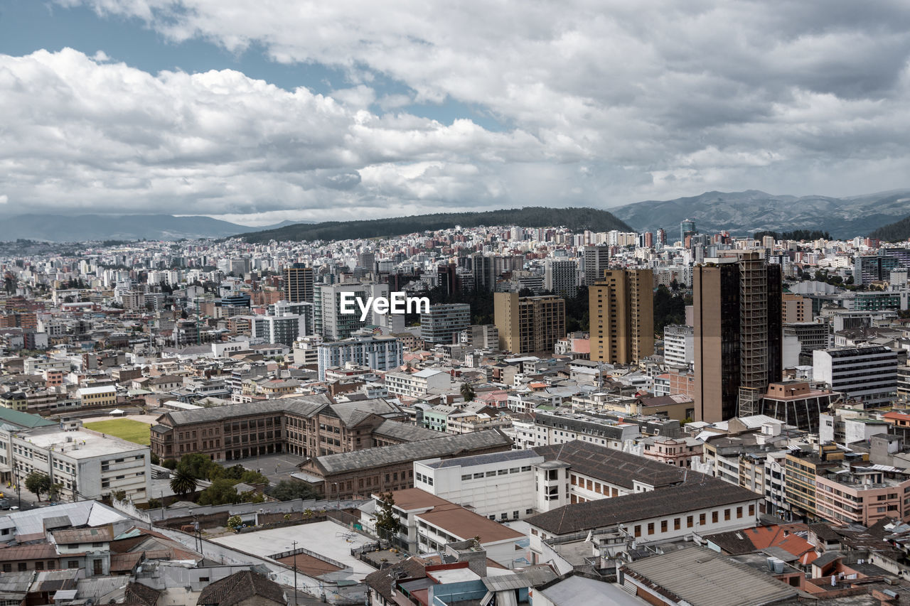 High angle view of buildings in city against sky