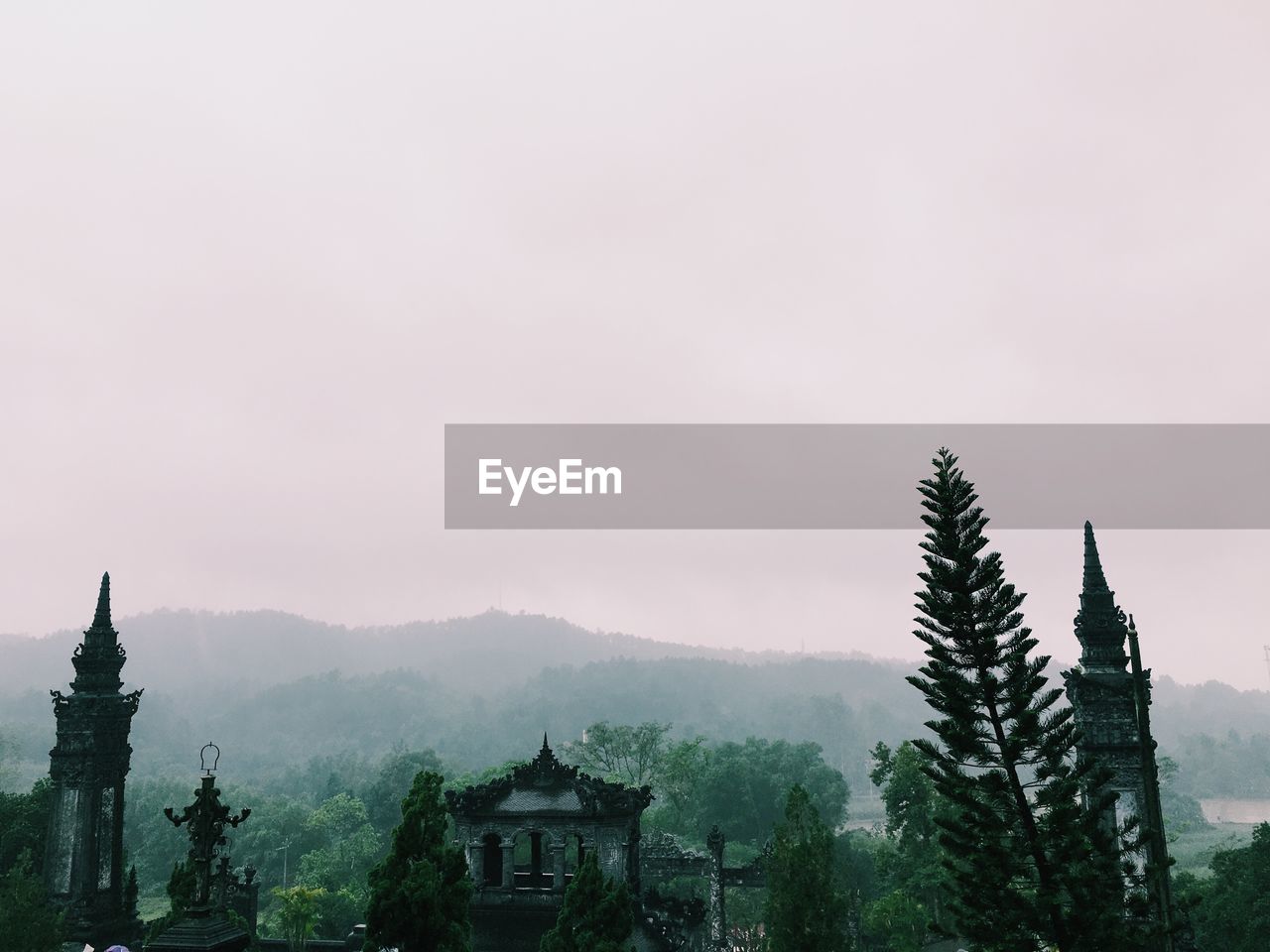 Historic temples by mountain against sky