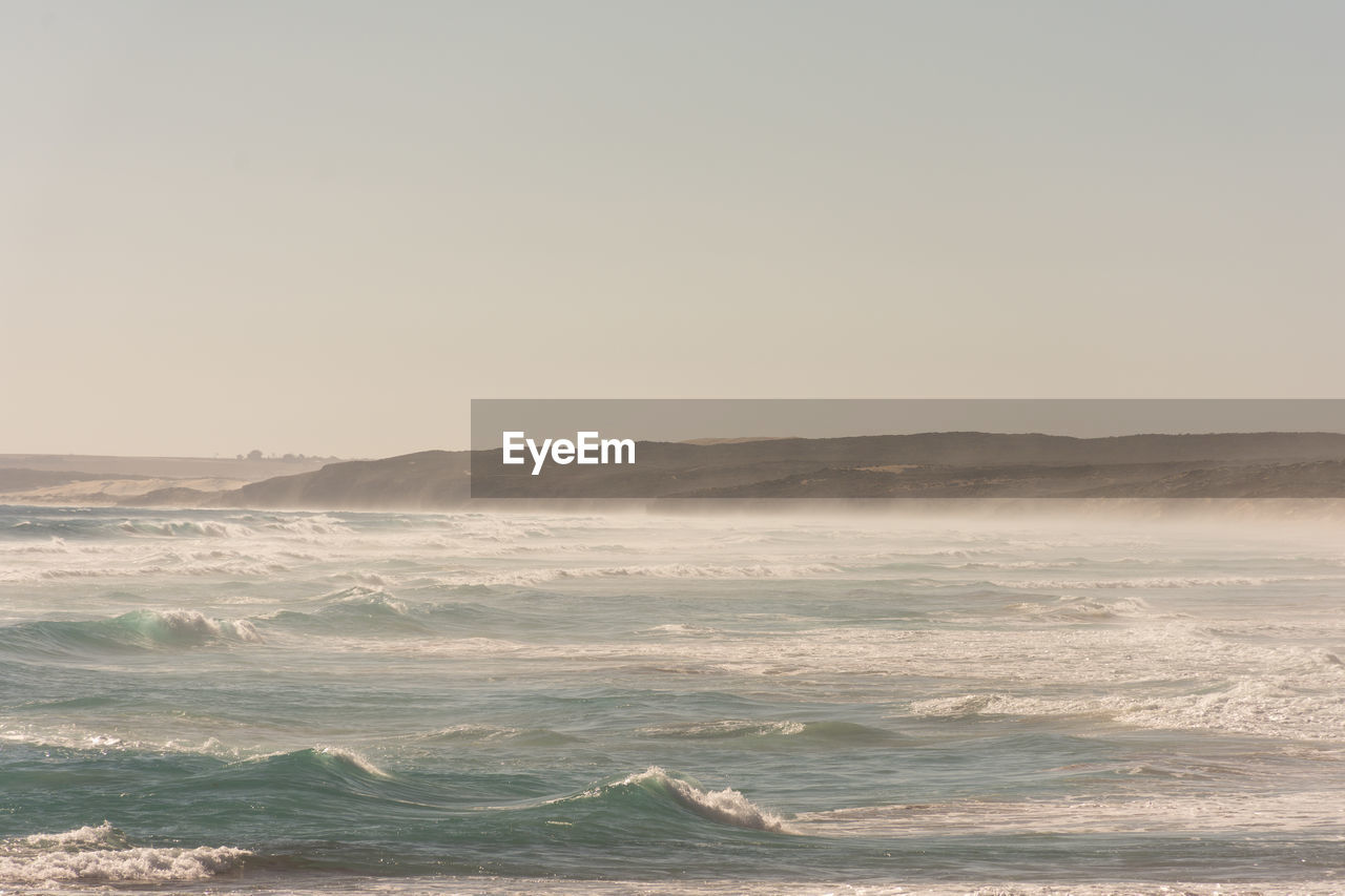 Scenic view of sea against clear sky