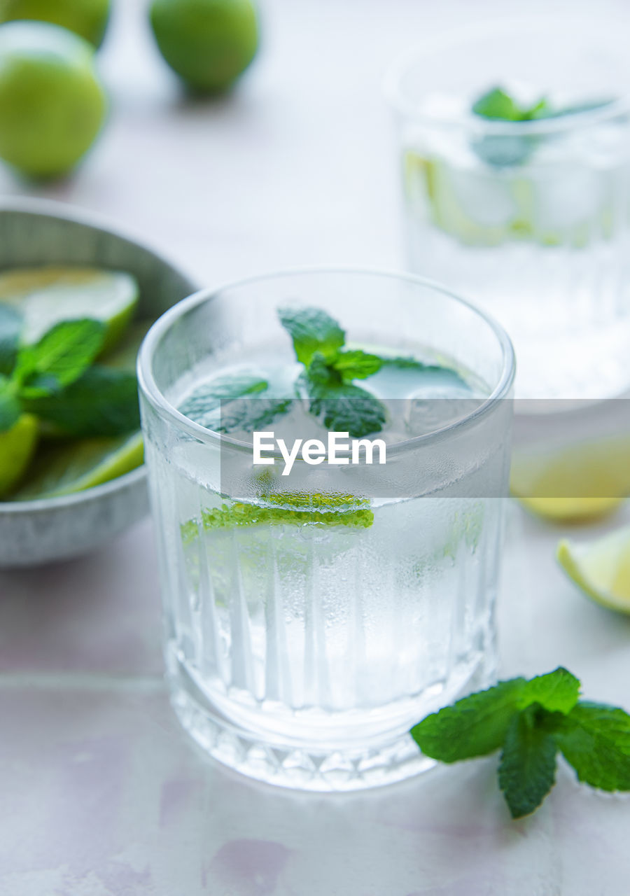 Iced cold lemonade with fresh lime and juice. summer drink in glass