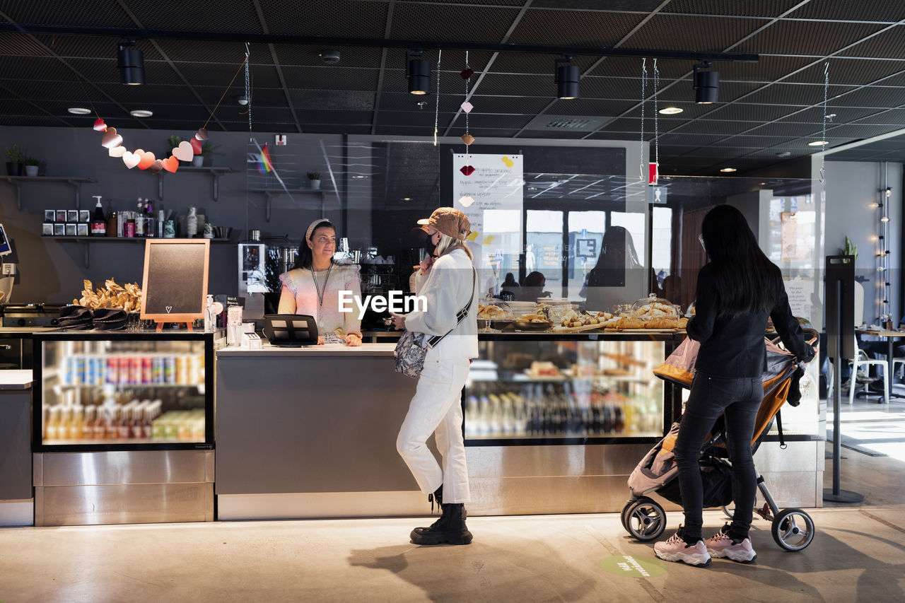 Women standing in line in cafeteria