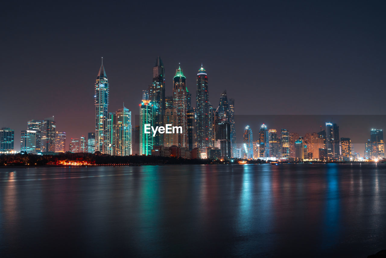 Illuminated buildings in city at night