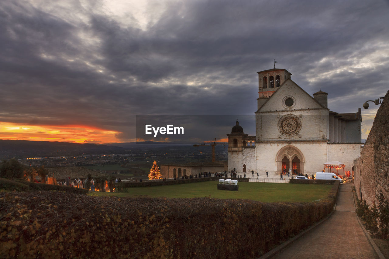 Church in assisi against sky during sunset