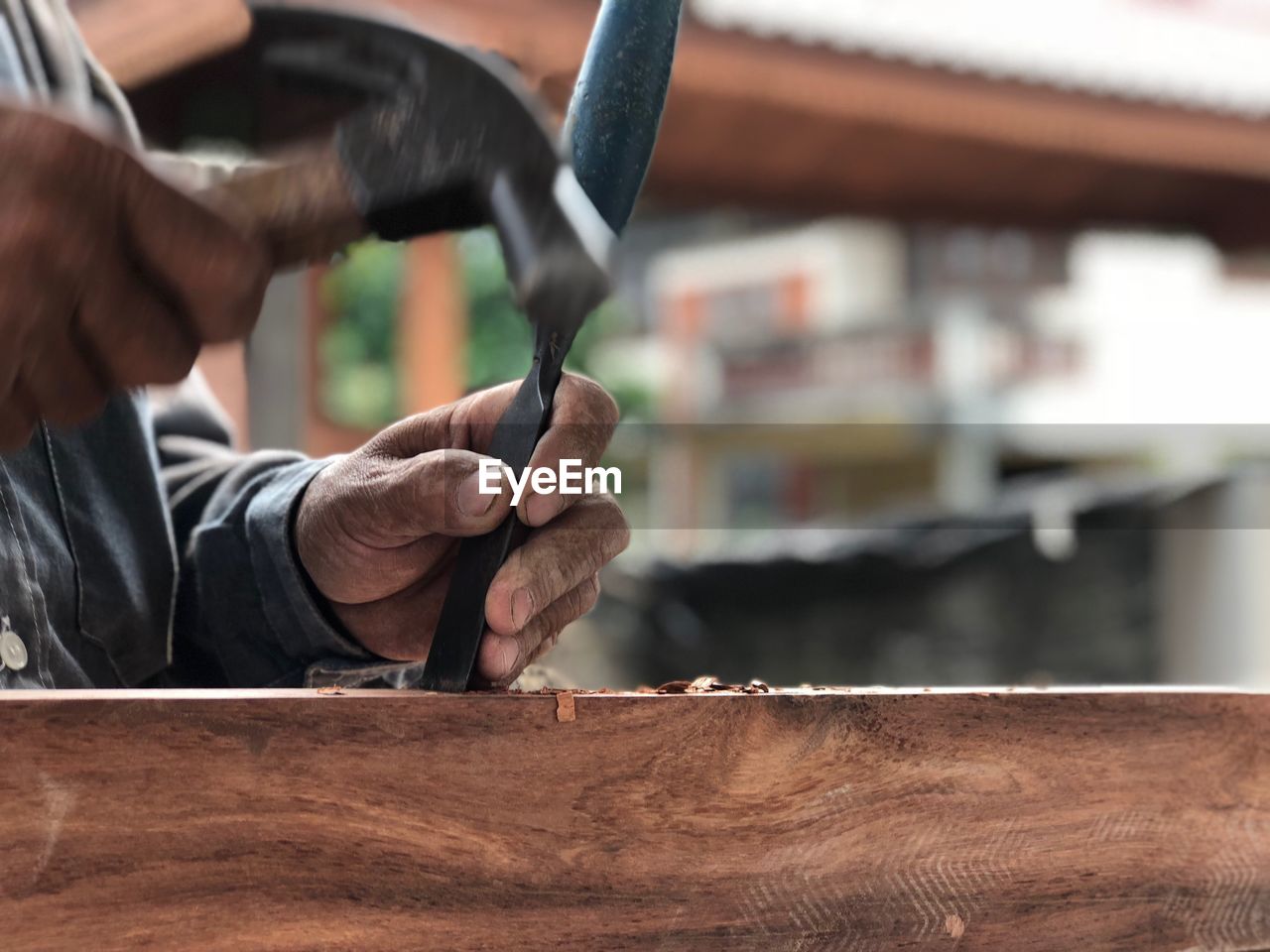 Midsection of man working outdoors