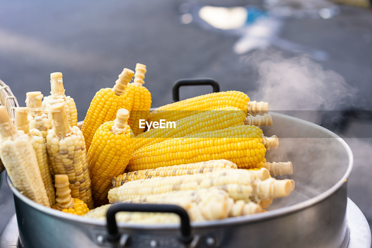 Close-up of yellow corn cobs steaming 