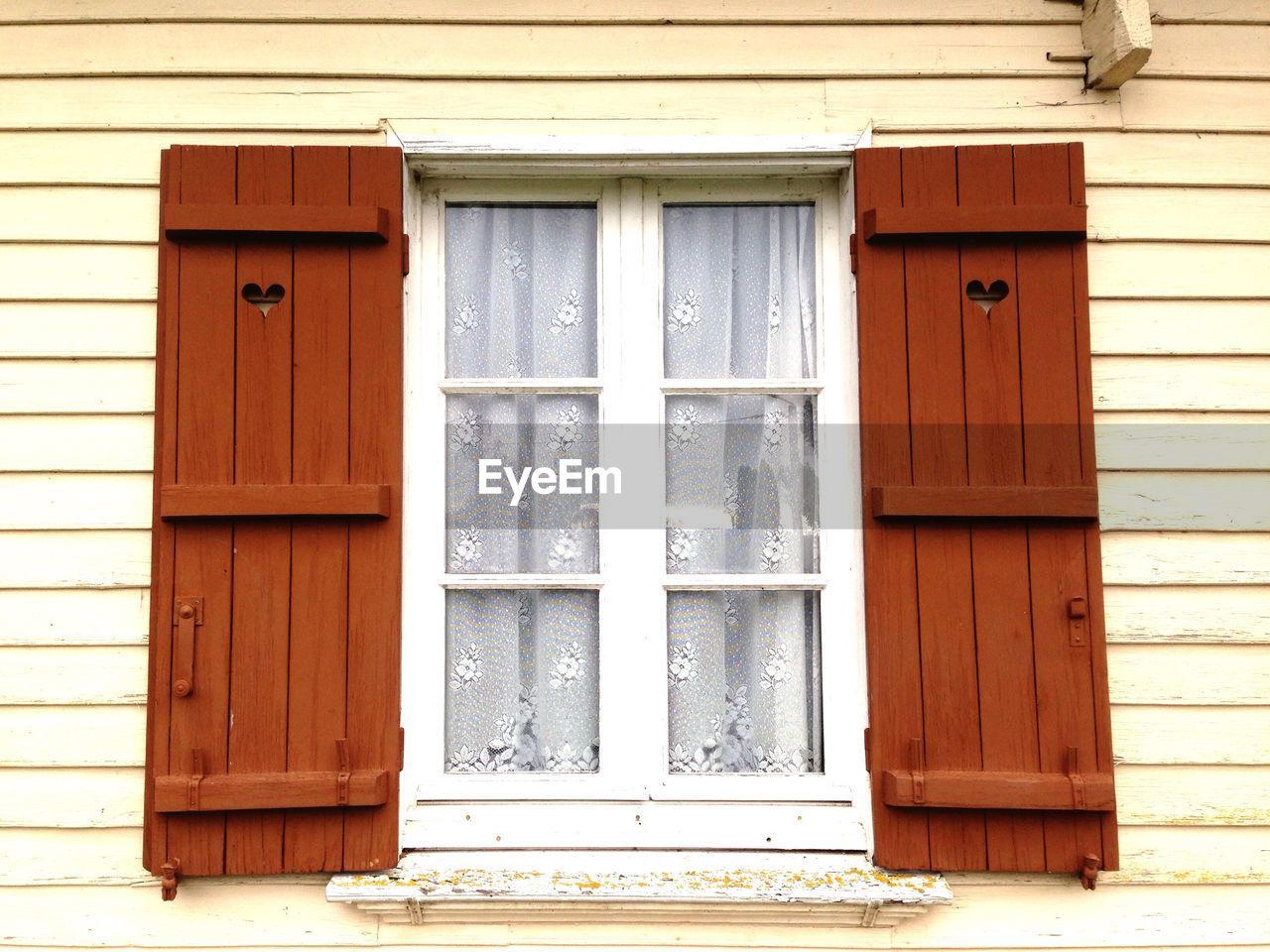 Low angle view of closed house window