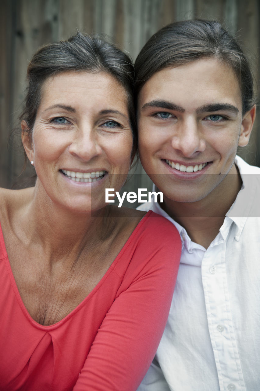 Portrait of mature woman with teenage son, sweden