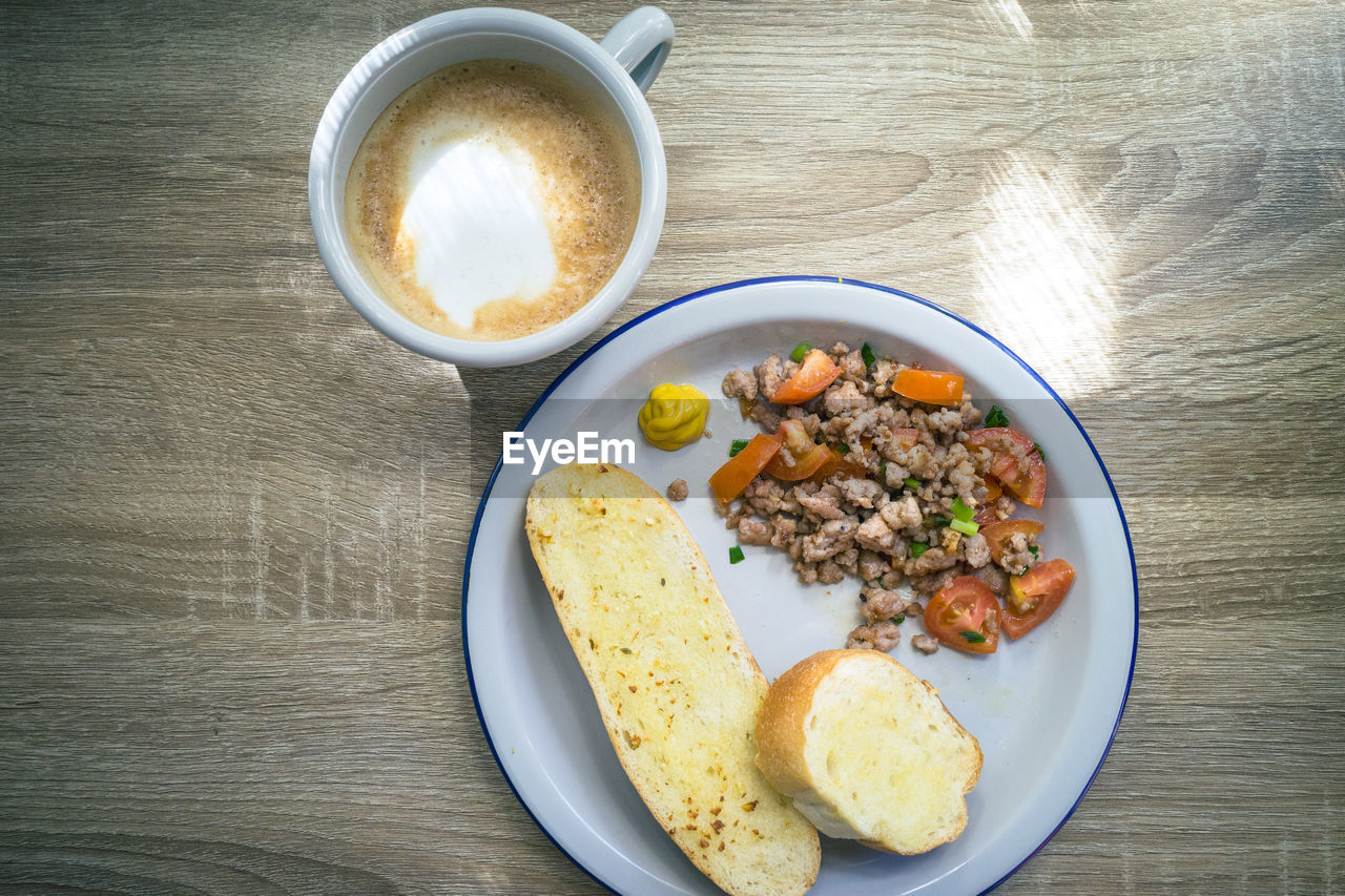 HIGH ANGLE VIEW OF BREAKFAST SERVED WITH COFFEE