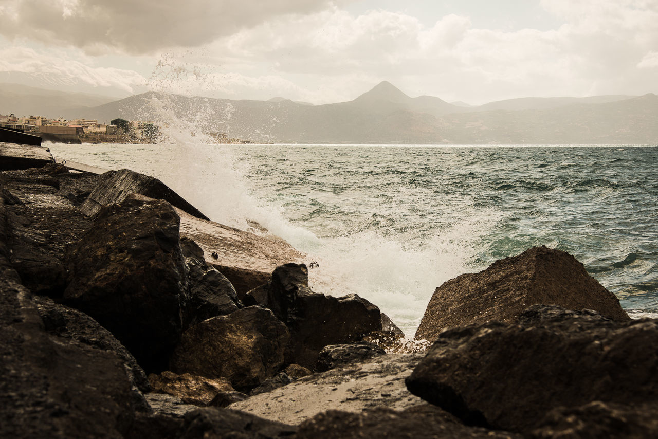 Scenic view of sea against cloudy sky