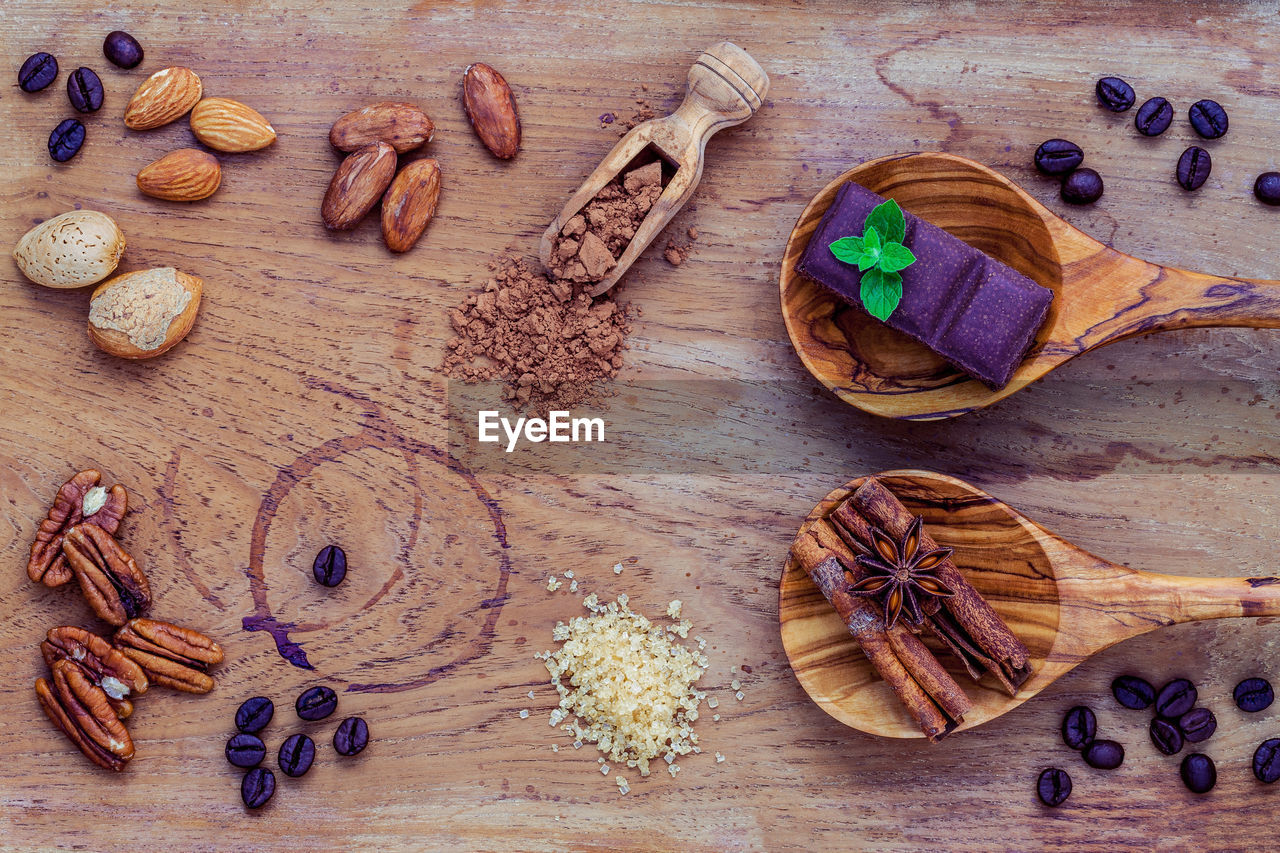 Directly above shot of nuts and spices on table