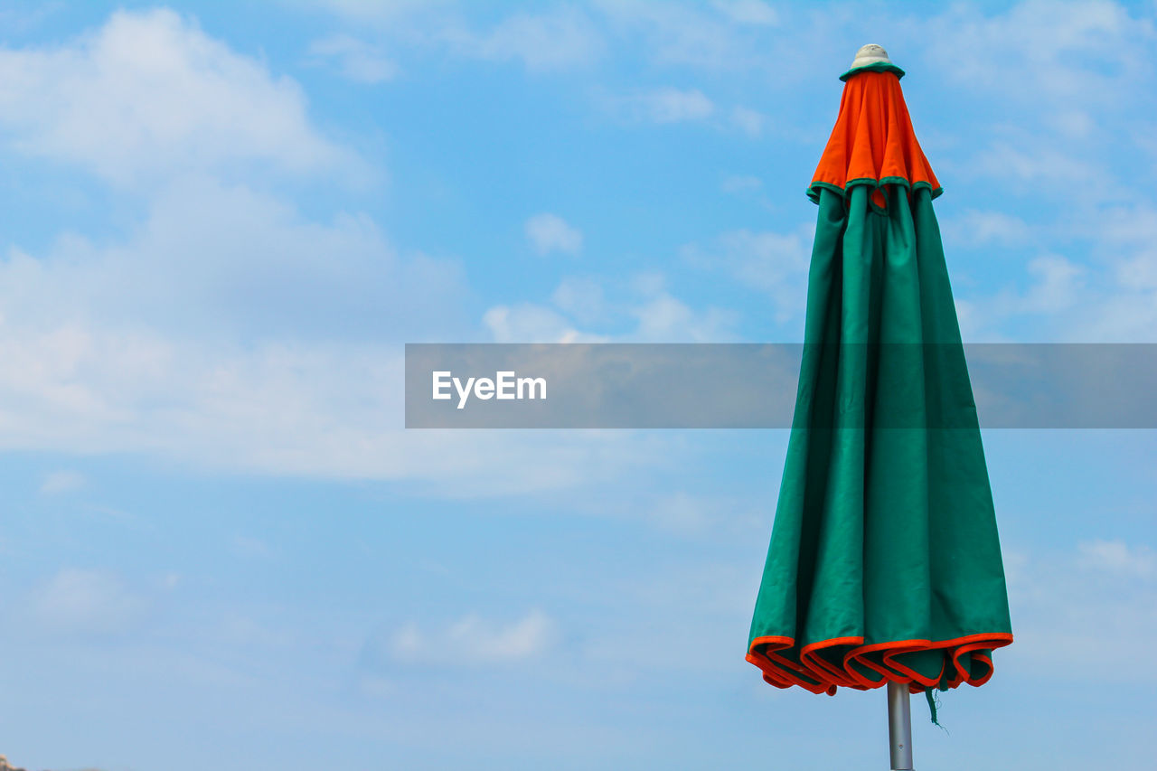 LOW ANGLE VIEW OF FLAG AGAINST SKY