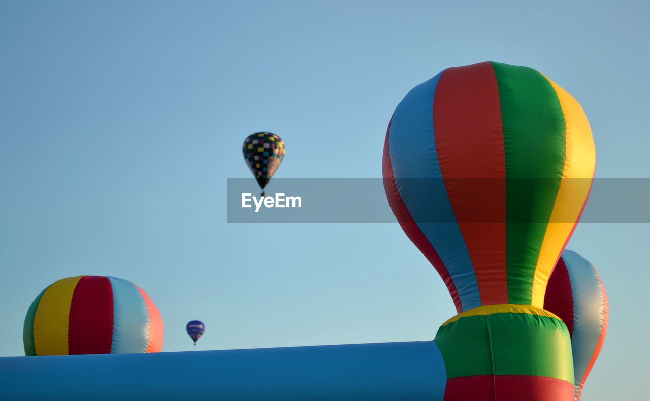 Low angle view of hot air balloons against sky
