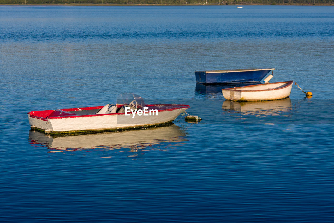 Boats moored in sea