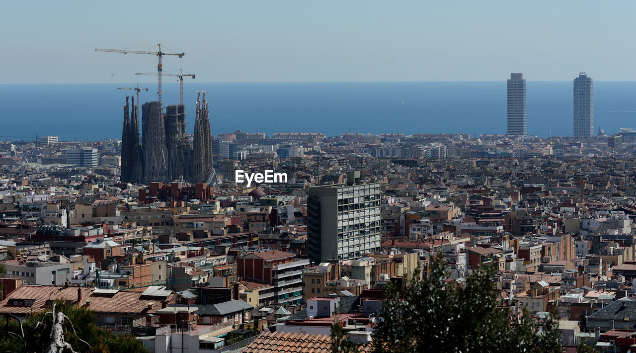 Aerial view of barcelona la sagrada familia against sky