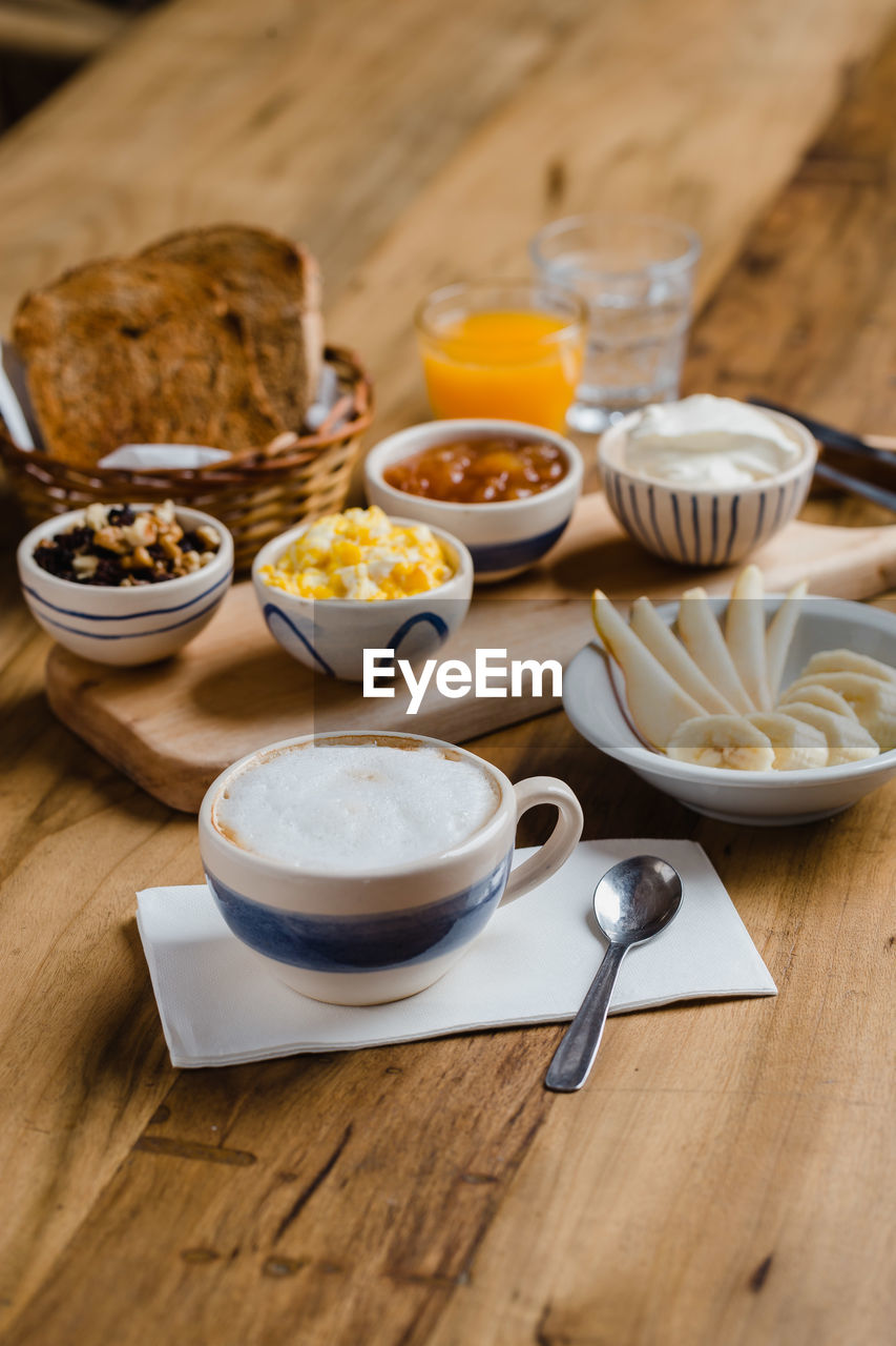 HIGH ANGLE VIEW OF BREAKFAST AND COFFEE ON TABLE