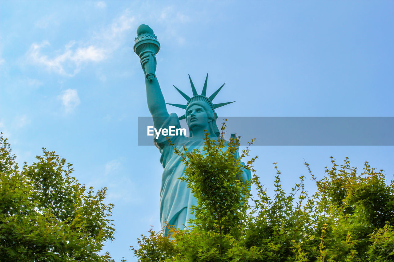 Statue of liberty against blue sky