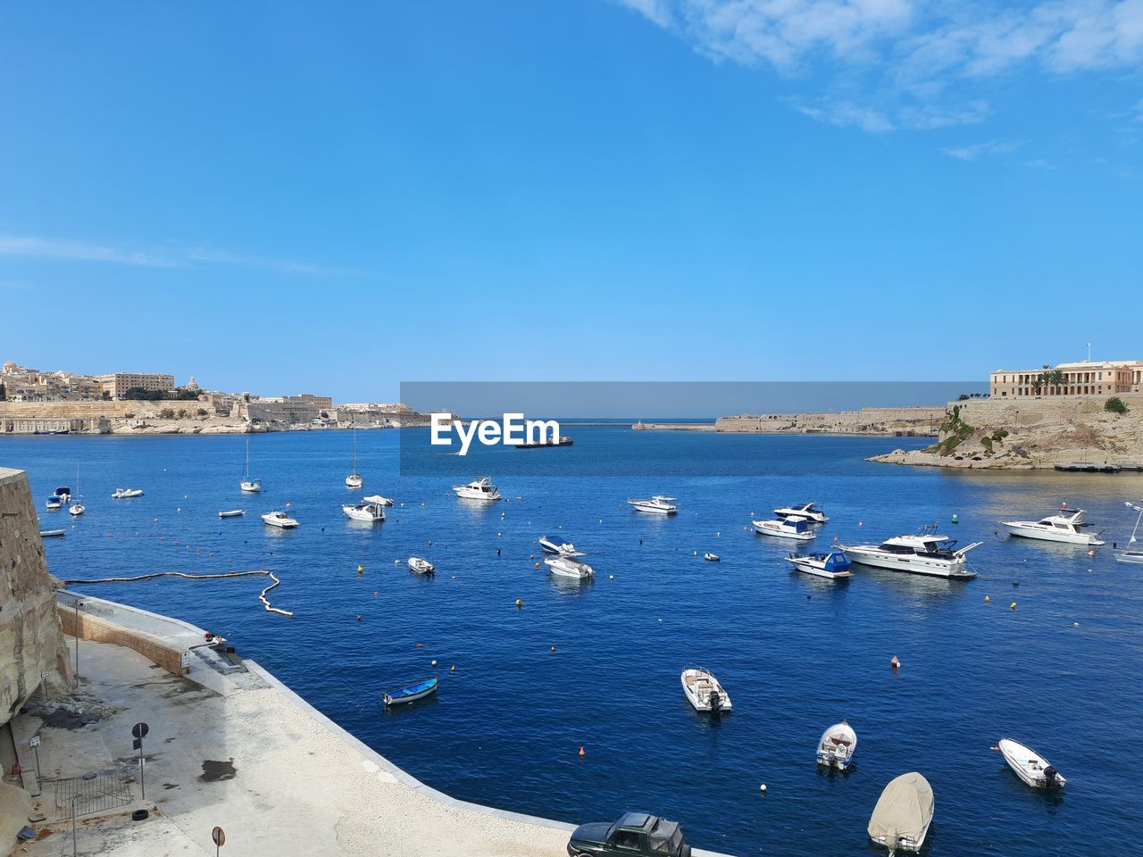 BOATS IN SEA AGAINST BLUE SKY