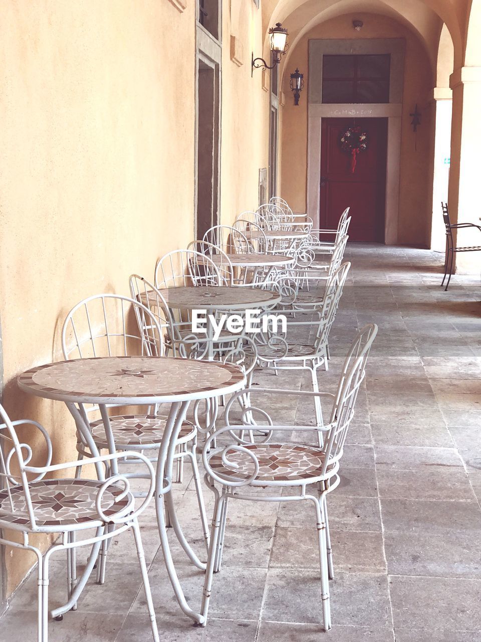 CHAIRS AND TABLE ON SIDEWALK