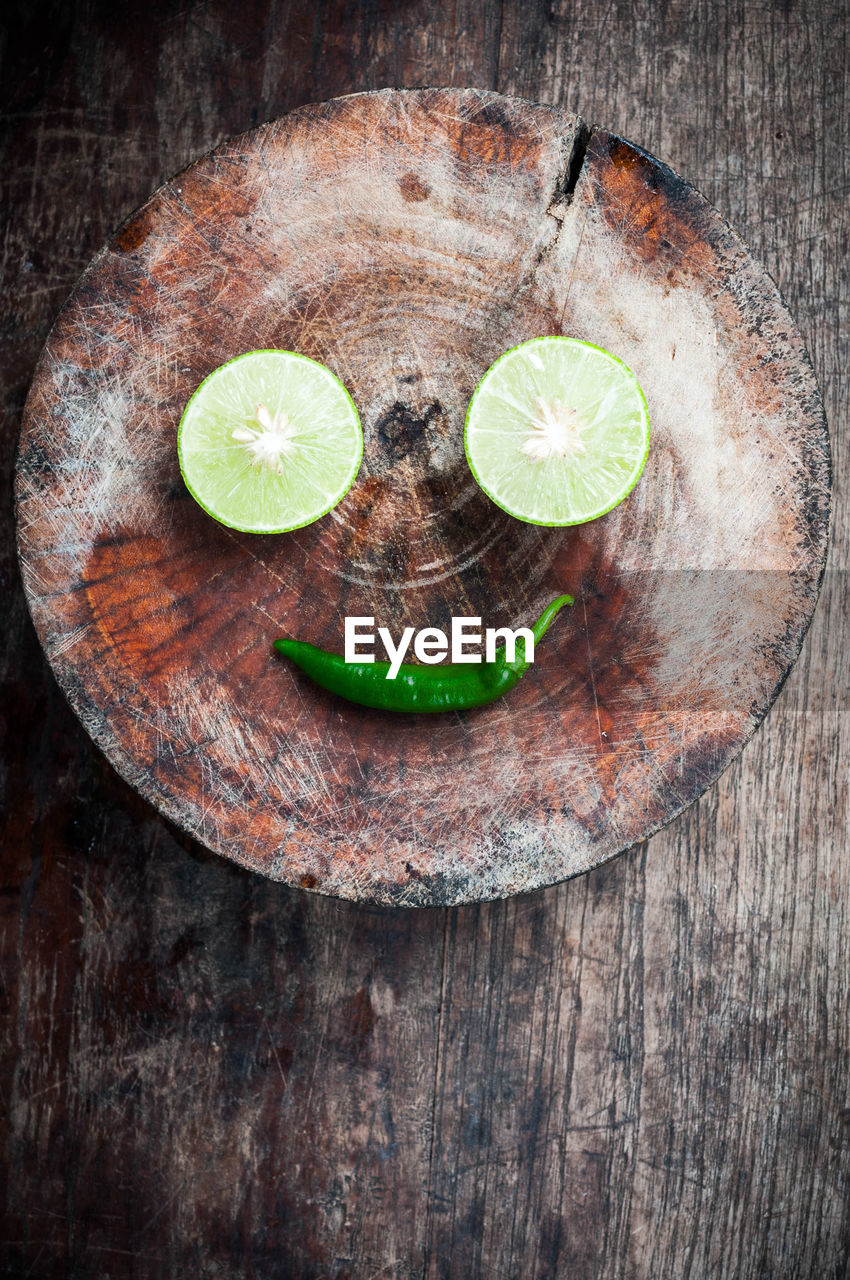 High angle view of lemon slices and chili