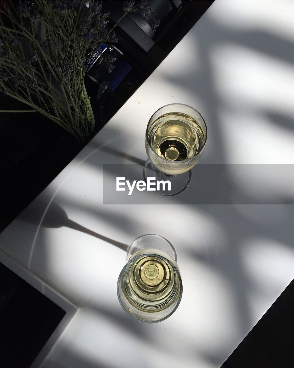 High angle view of glass bottle on table