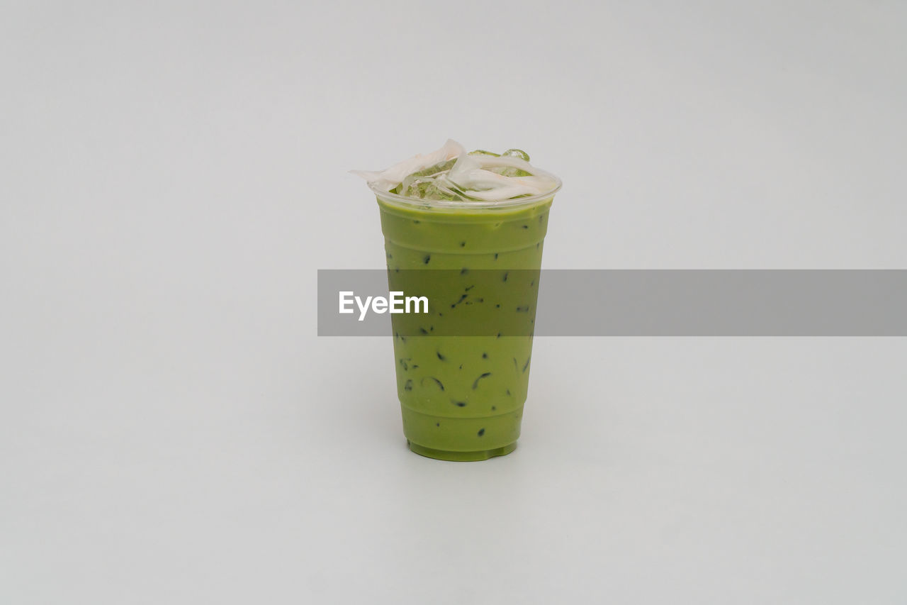 close-up of drink in glass against white background