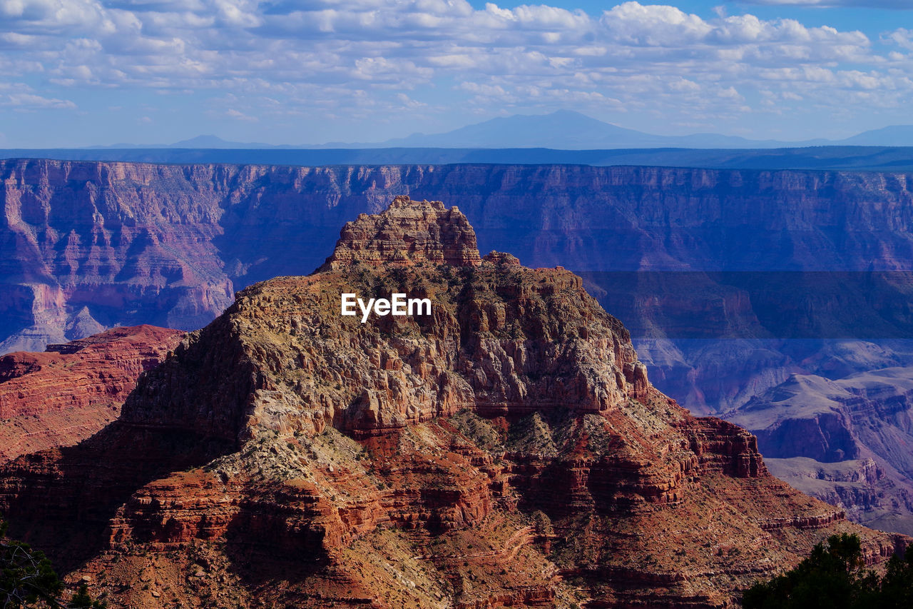 Panoramic view of rock formations against sky