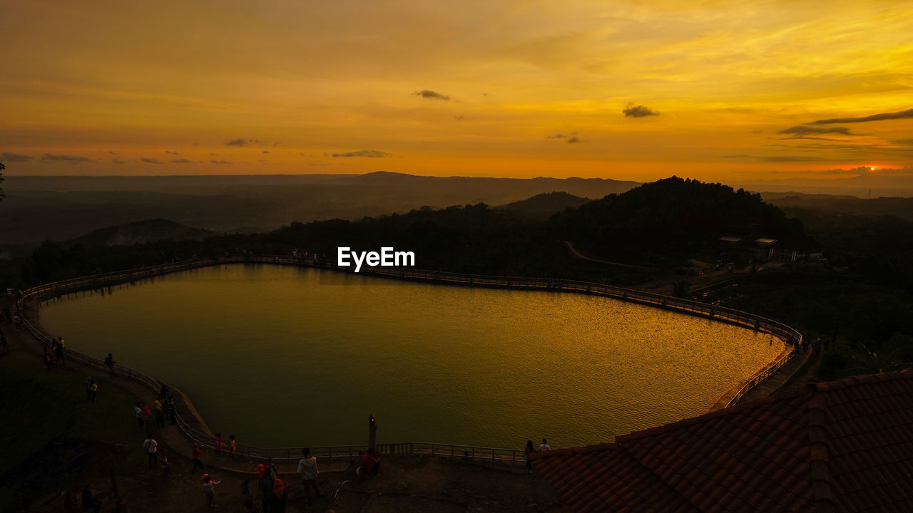 PANORAMIC VIEW OF RIVER AGAINST SKY DURING SUNSET