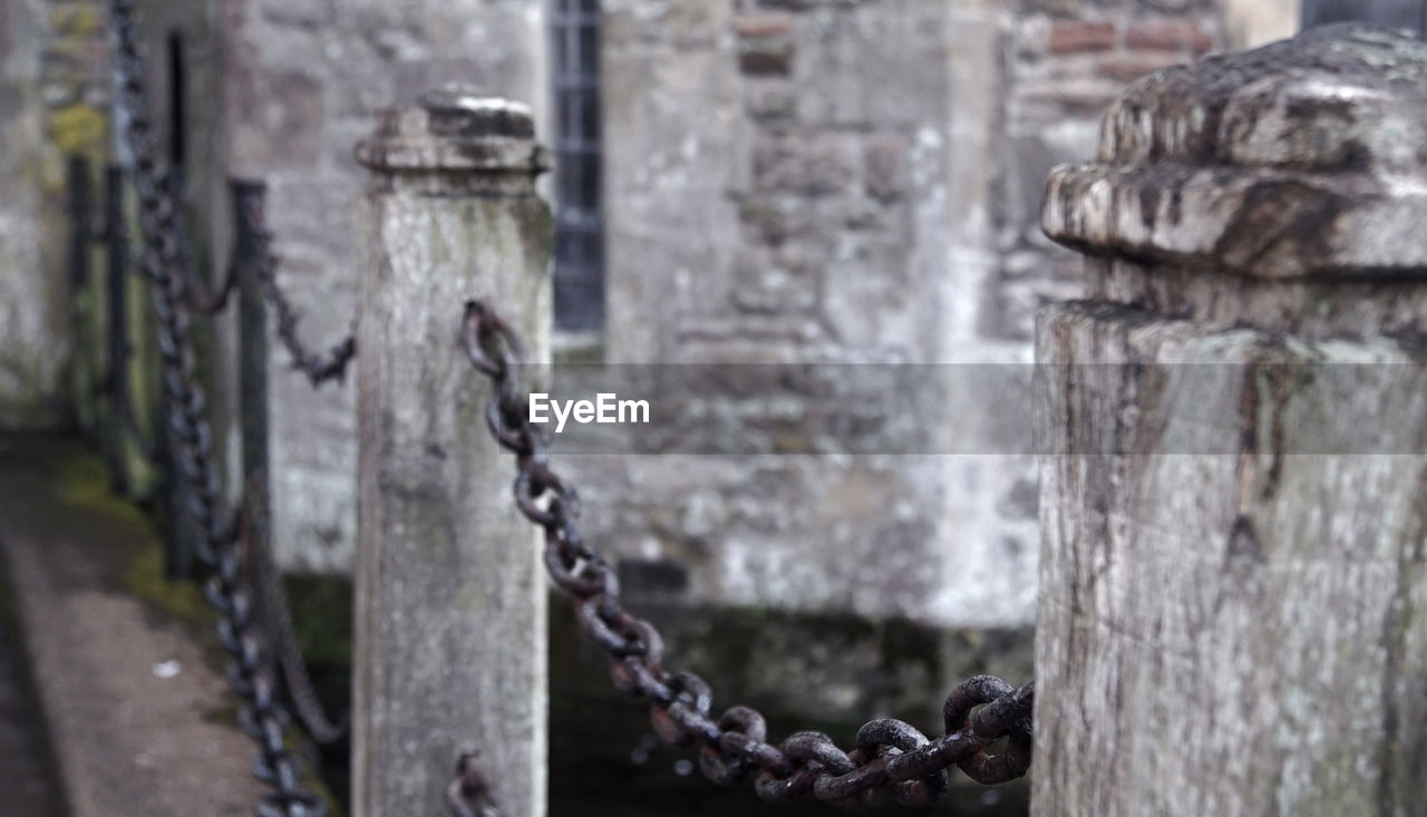 Close-up of chain on railing