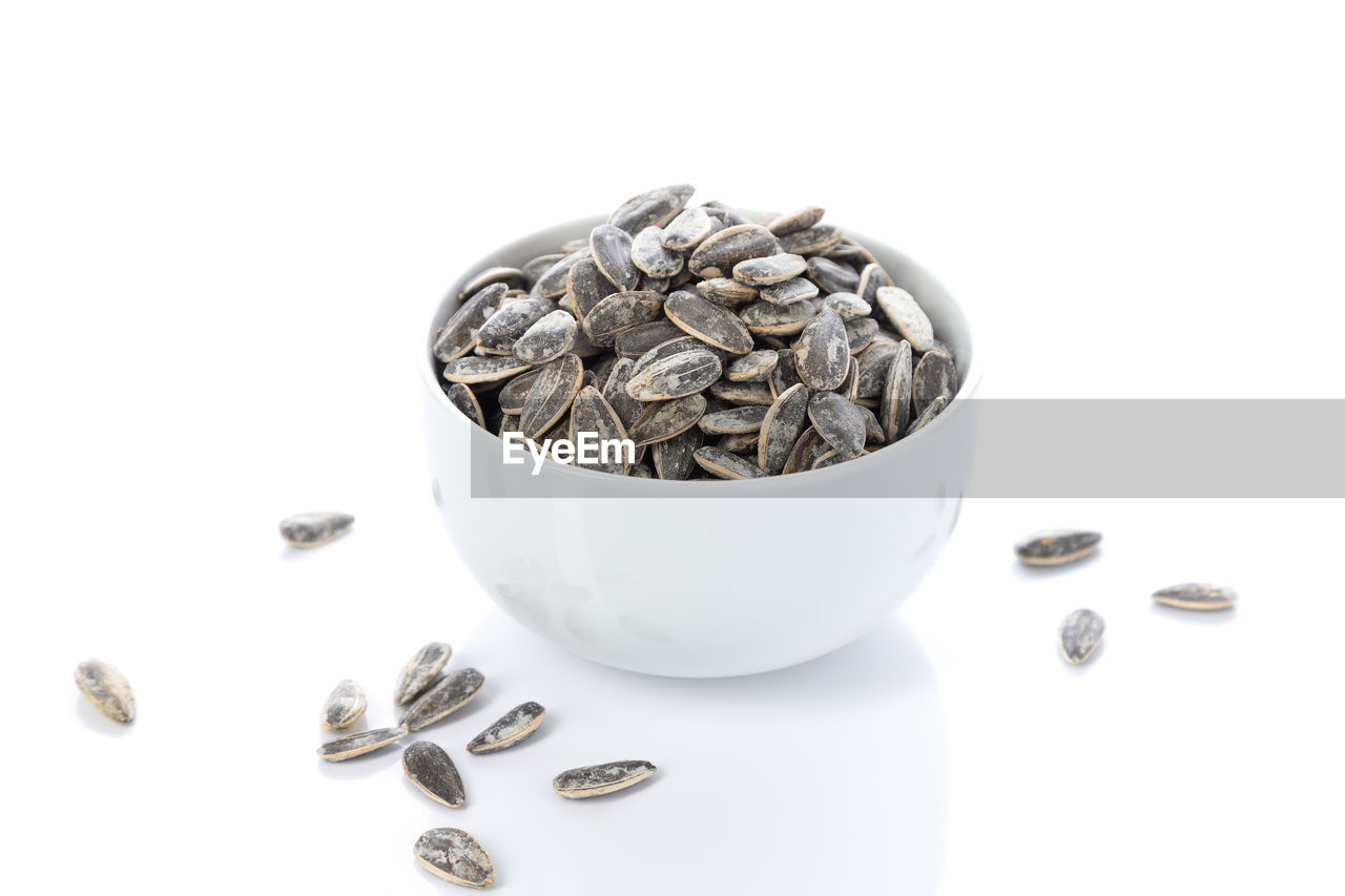 white background, food and drink, studio shot, cut out, food, large group of objects, finance, wealth, indoors, coin, wellbeing, no people, bowl, business, savings, heap, metal, healthy eating