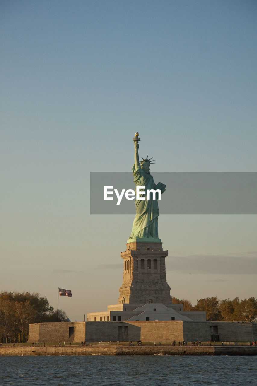 Statue of liberty against sky during sunset