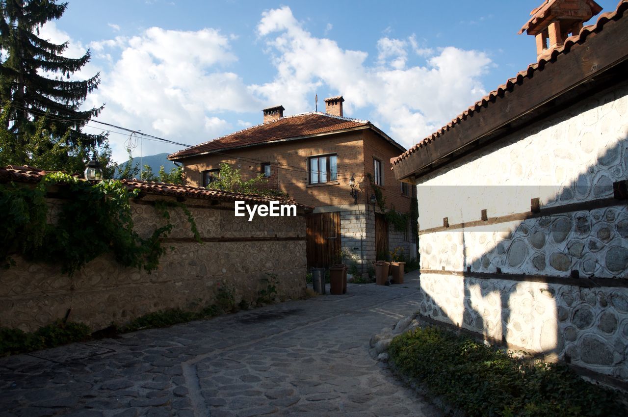 VIEW OF HOUSES AGAINST SKY