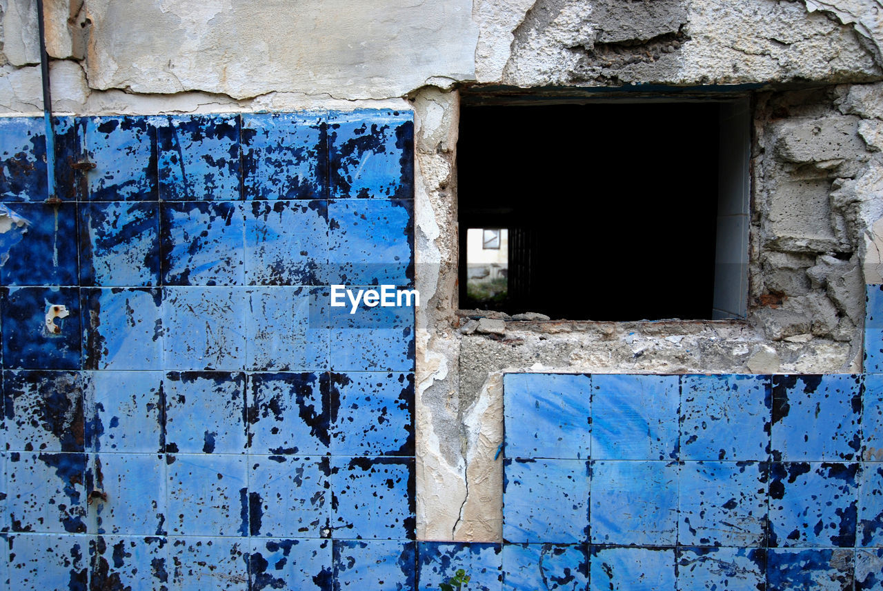 OLD WEATHERED WALL WITH WINDOWS