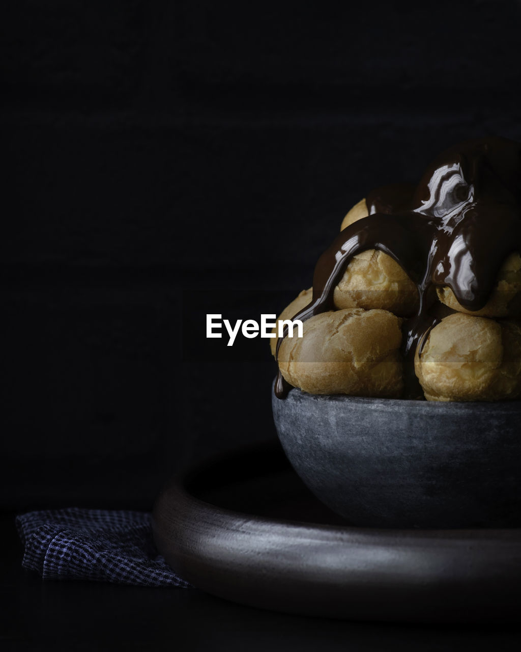 Profiteroles ,fresh choux pastry covered in a rich chocolate sauce