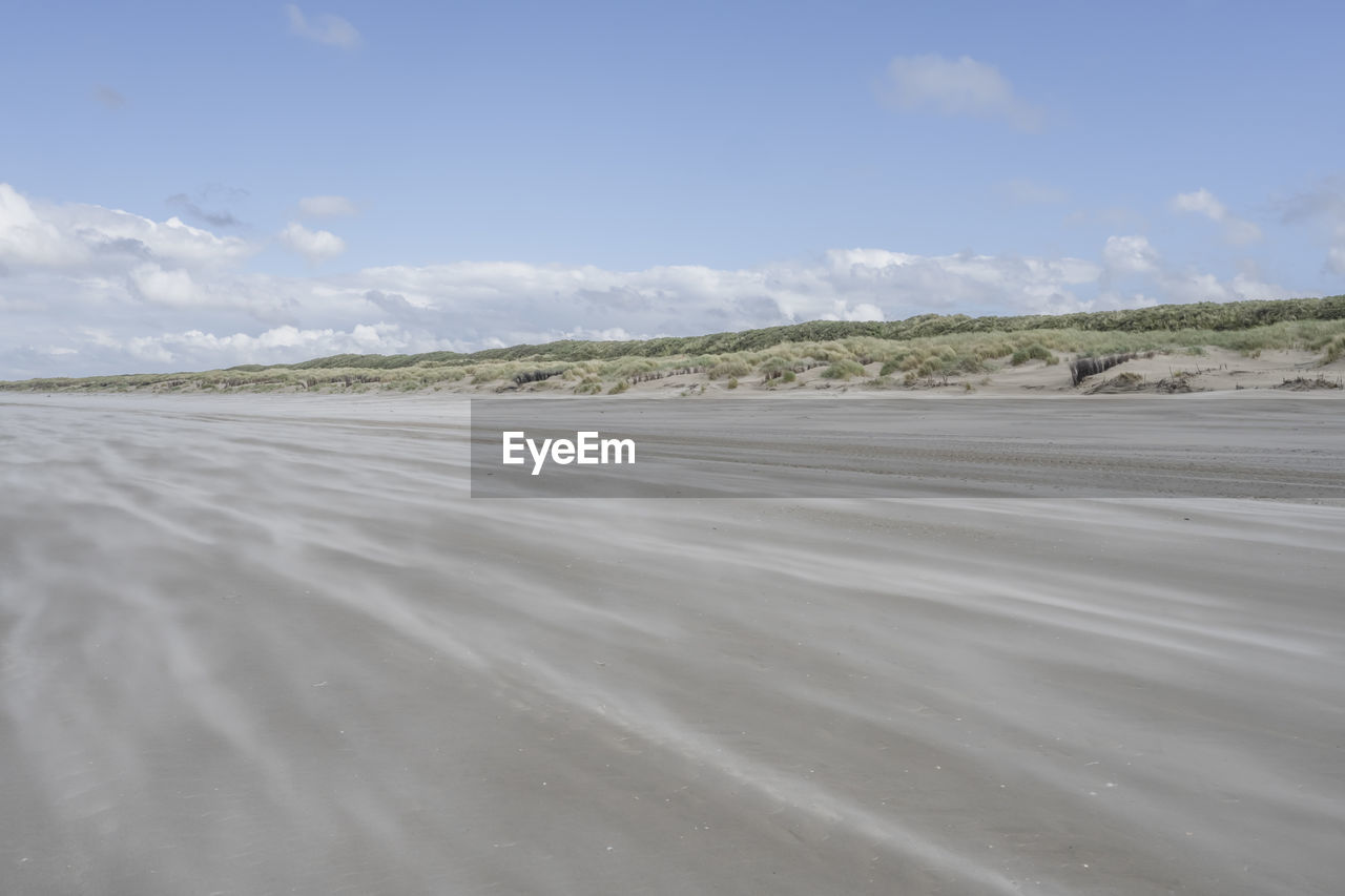 Germany, lower saxony, juist, empty beach in summer with dunes in background