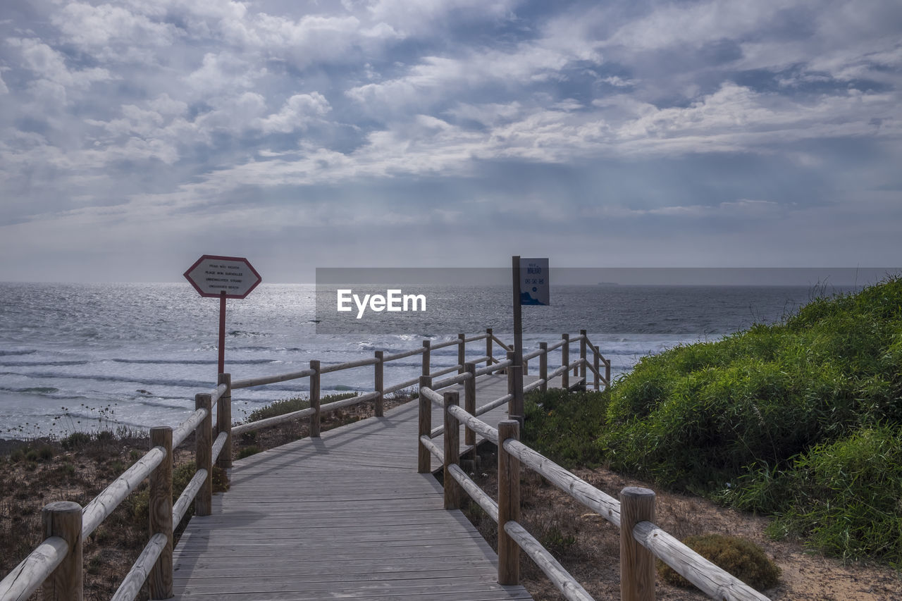 PIER OVER SEA AGAINST SKY