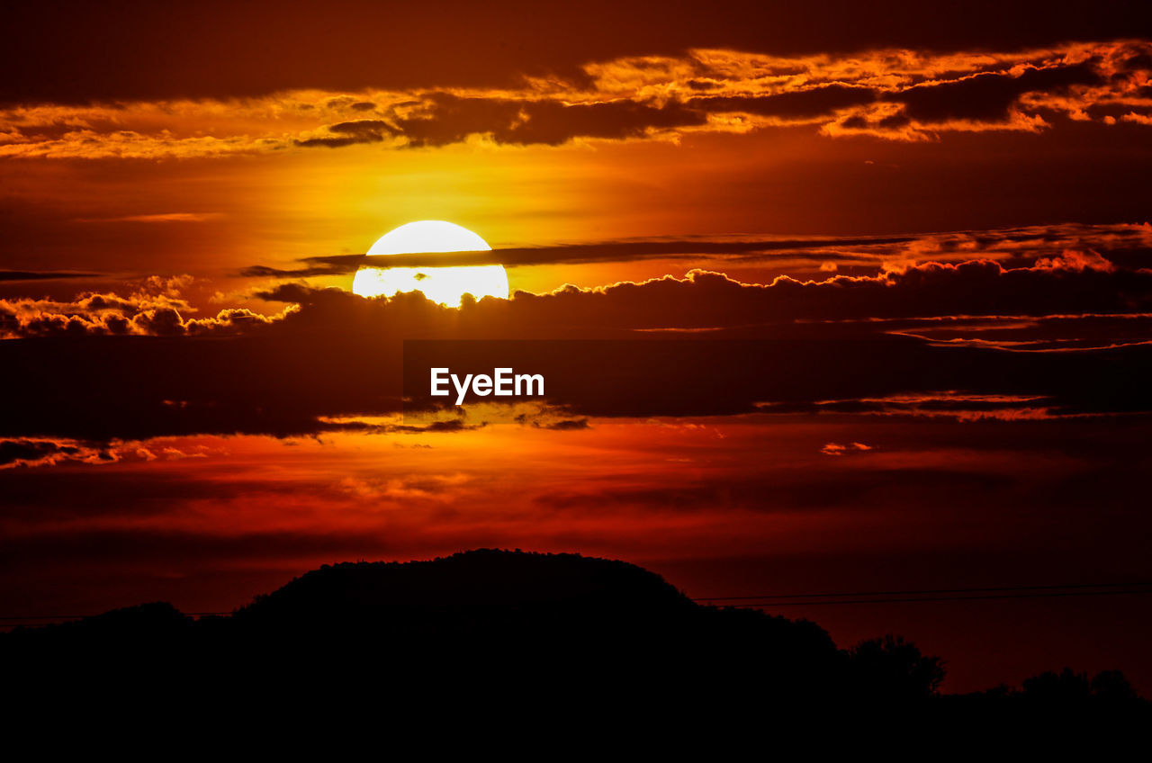 Scenic view of dramatic sky during sunset