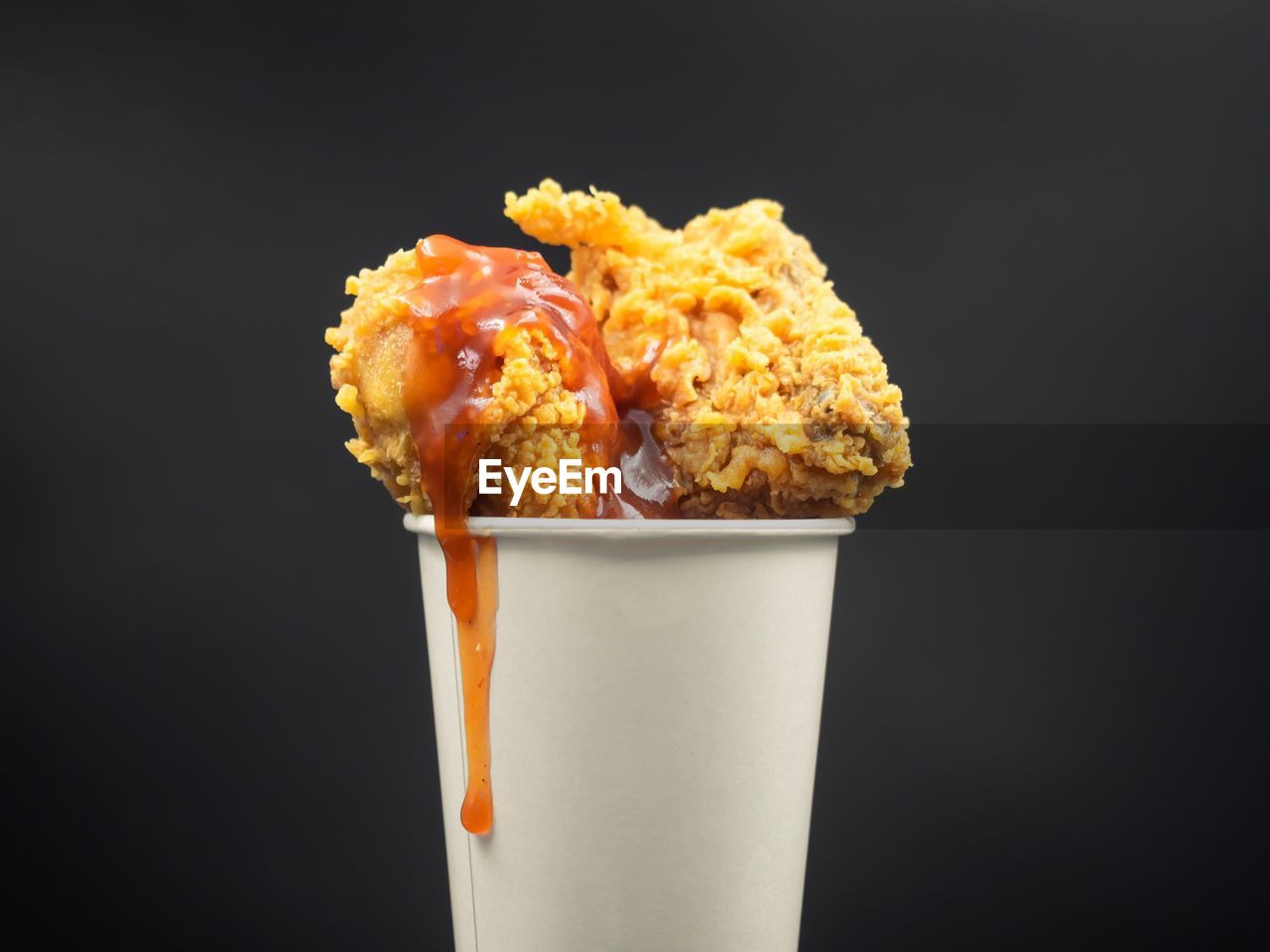 Close-up of food in glass against black background