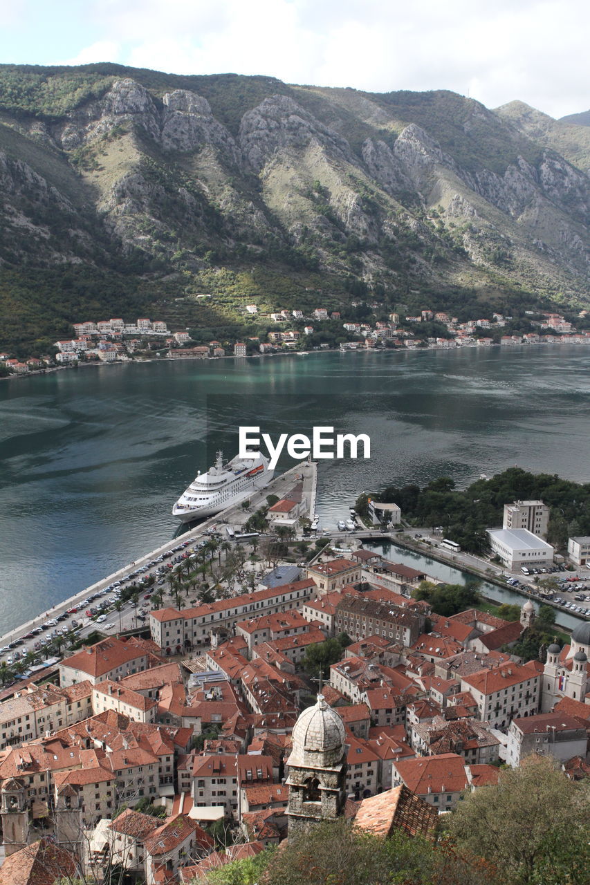 High angle view of townscape by lake