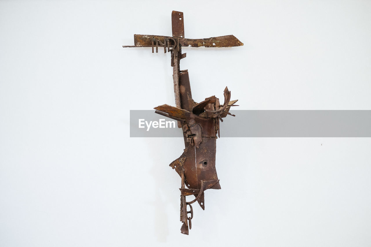 High angle view of rusty metal on white background