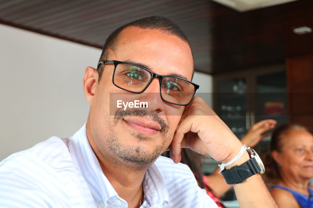 Portrait of smiling man wearing eyeglasses