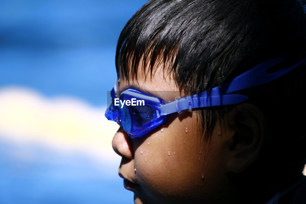 Close-up of boy wearing swimming goggles