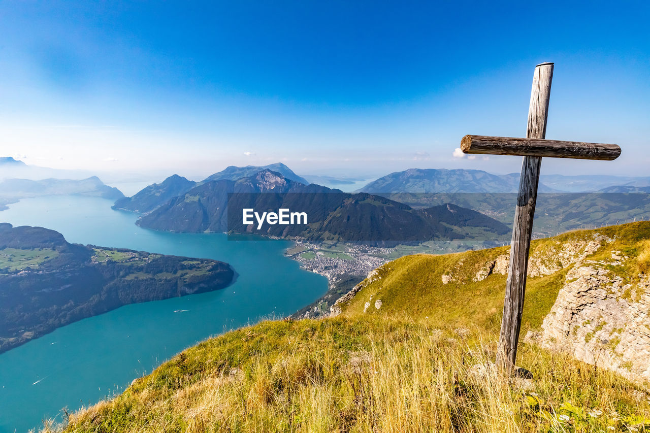 Scenic view of mountains against blue sky