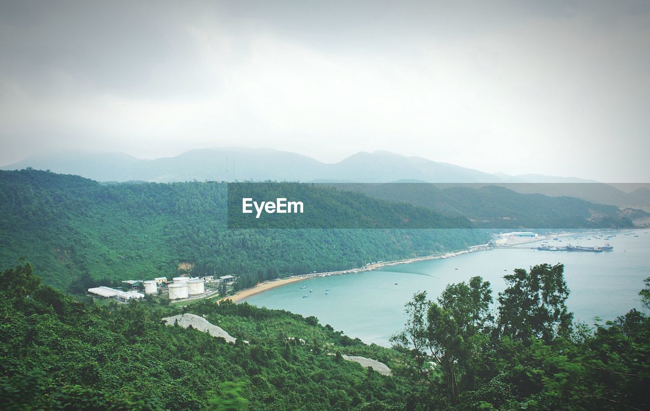 Scenic view of landscape against cloudy sky