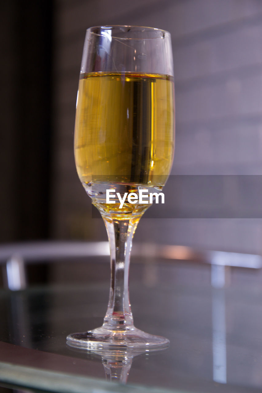 Close-up of vine glass on table