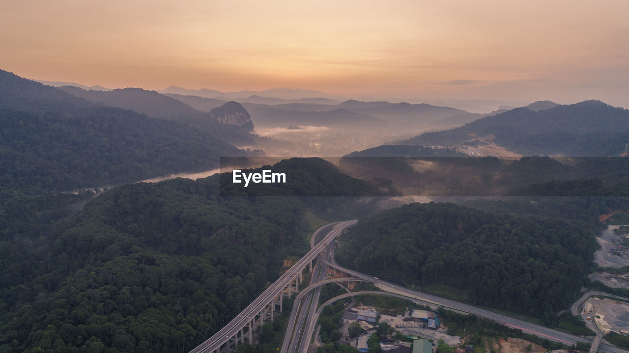 High angle view of mountains against sky during sunset